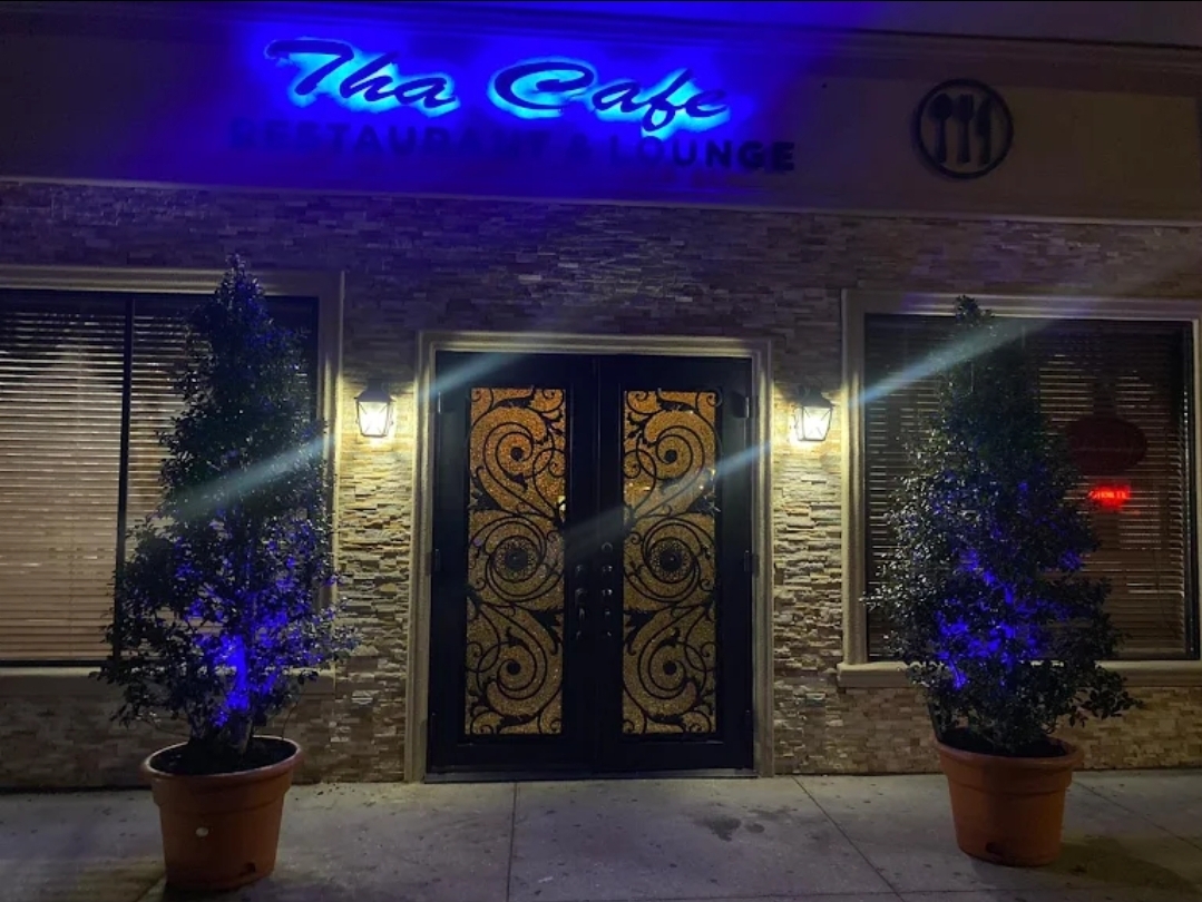 Tha Cafe exterior at night